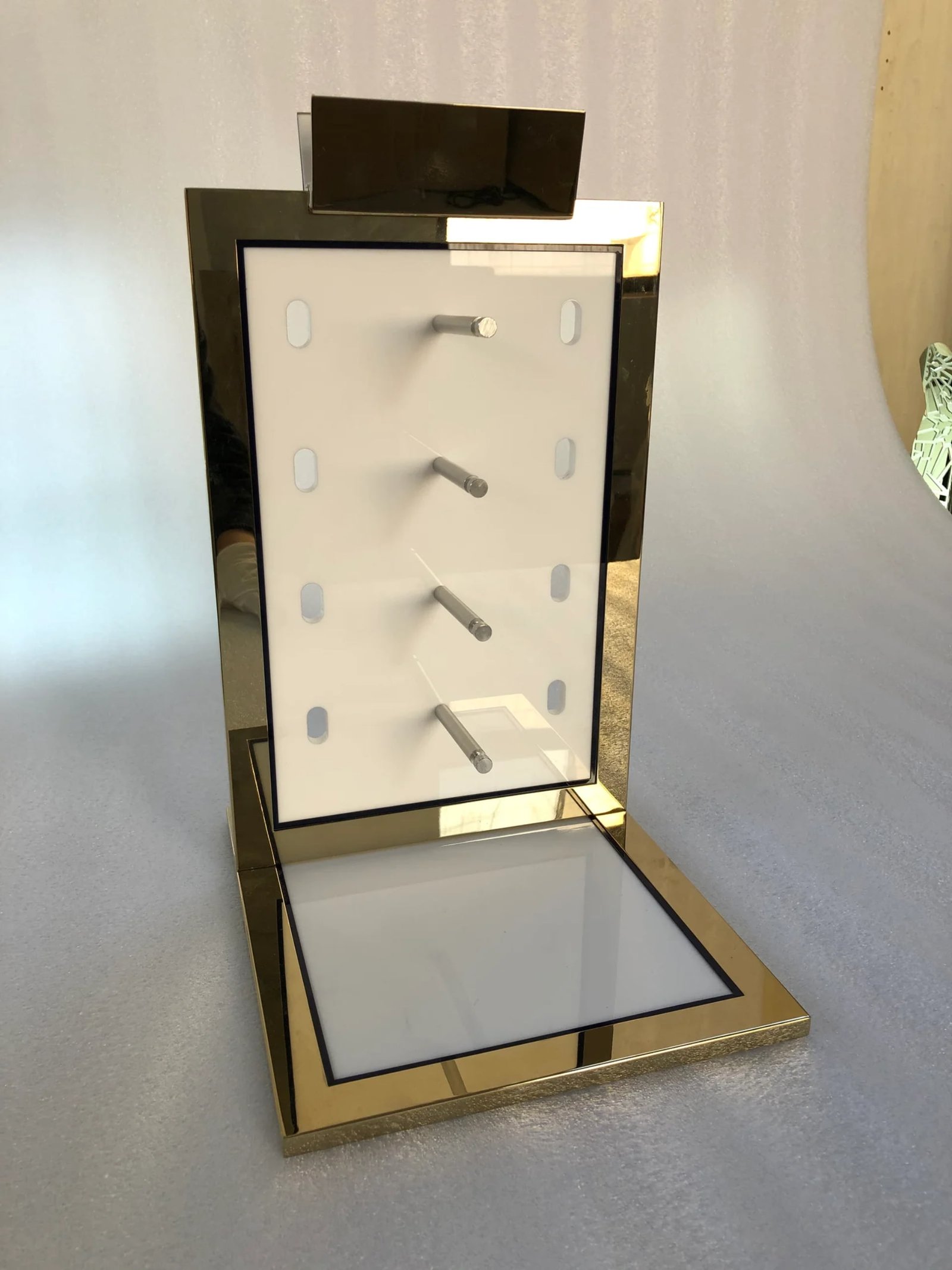 Custom eyewear display stands -- sunglass racks and optical frame holders for luxury boutiques, manufactured by DNY Display