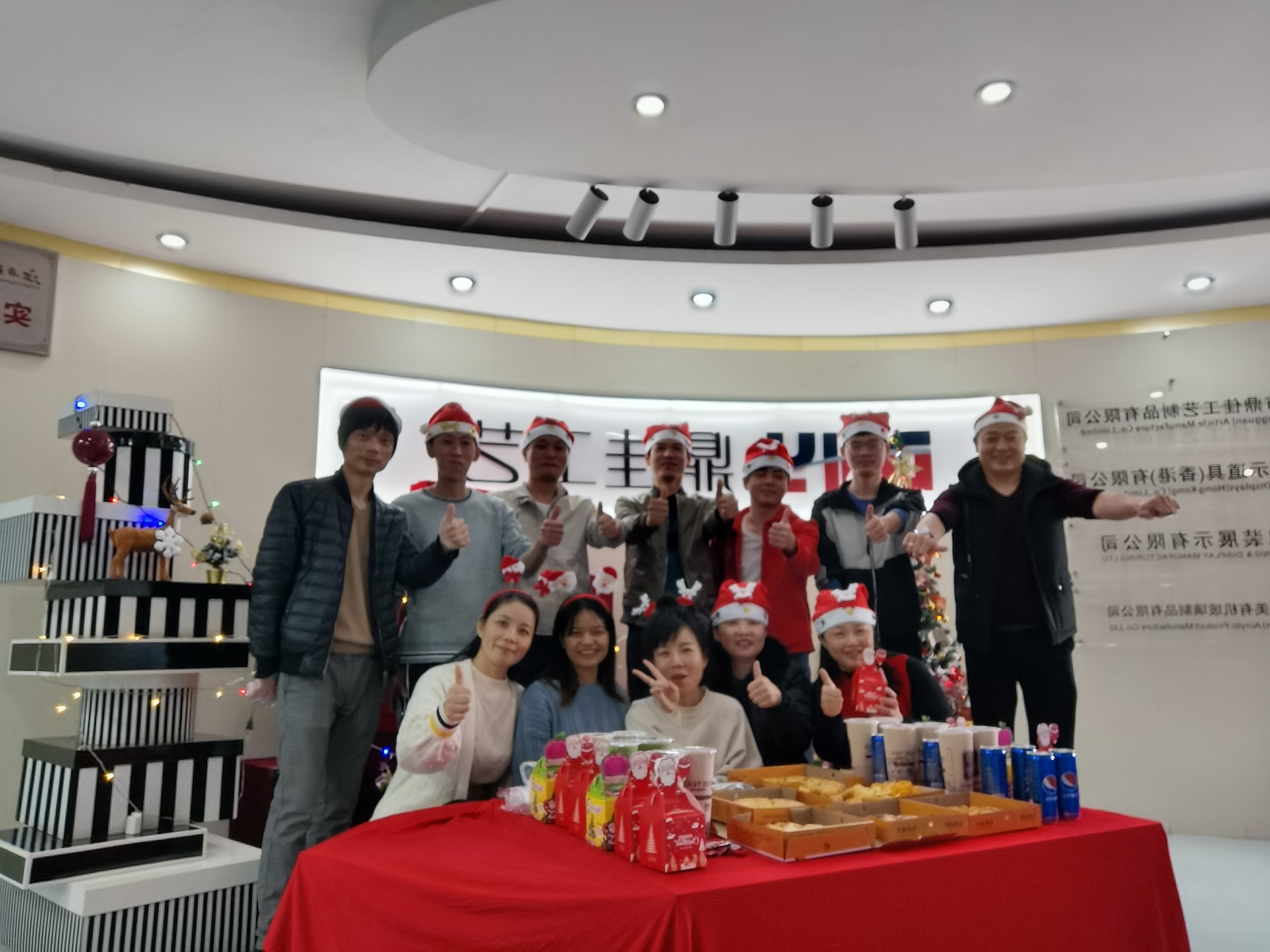 DNY Display workshop team photo -- craftsmen and staff gathered for a group celebration
