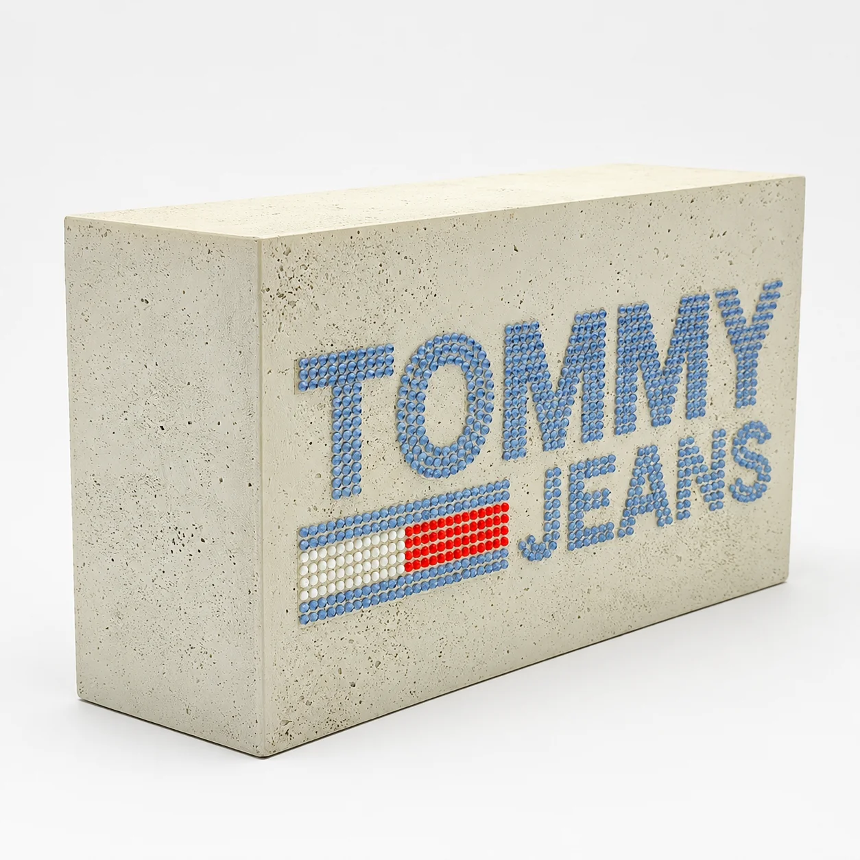 Custom cement logo block for modern retail presentation