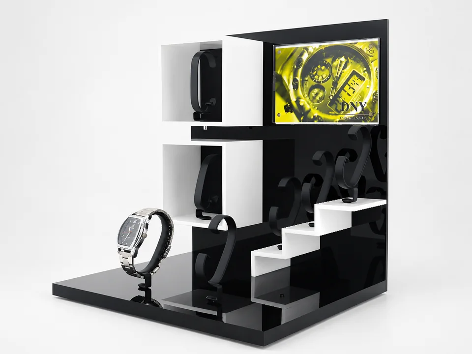 Custom black and white watch display with integrated LCD screen and individual watch holders