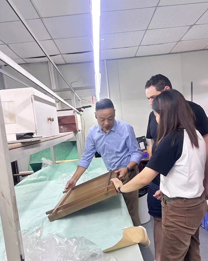 DNY team explaining the structure, assembly and workmanship of a custom retail display to visiting clients